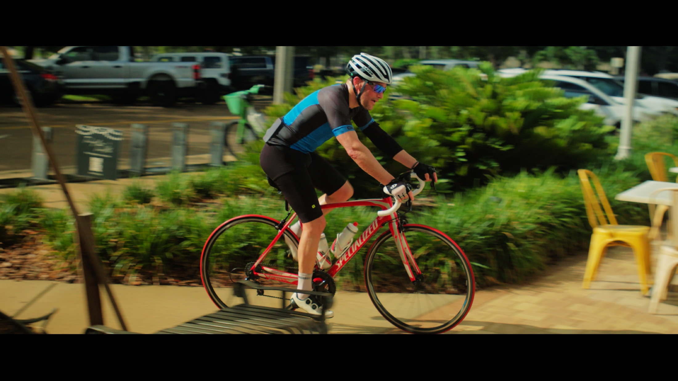Cyclists gather in conversation at a ride meetup.